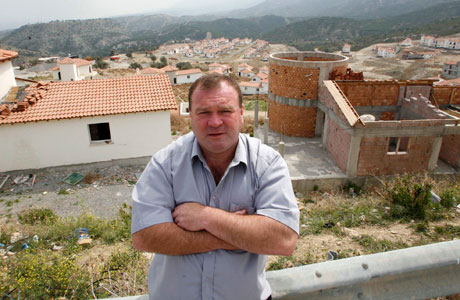 Gary Robb posing in front of the Amaranta Valley site in Girne, North Cyprus
