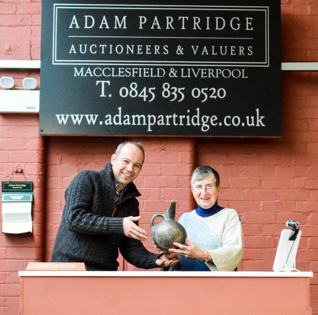 Thelam Bishop shows her souvenir Turkish jug to Adam Partridge